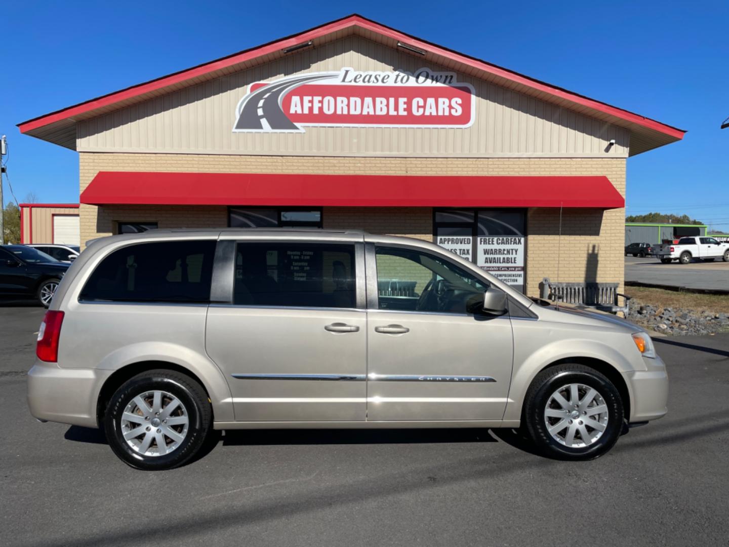 2014 Gold Chrysler Town and Country (2C4RC1BG9ER) with an V6, 3.6 Liter engine, Auto, 6-Spd AutoStick transmission, located at 8008 Warden Rd, Sherwood, AR, 72120, (501) 801-6100, 34.830078, -92.186684 - Photo#0